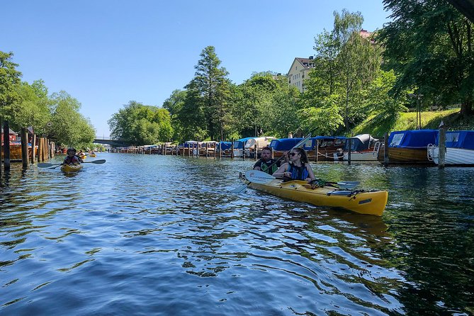 Stockholm City Evening Kayak Tour - The Midsummer meal stop: food served on a scenic shore, with local context